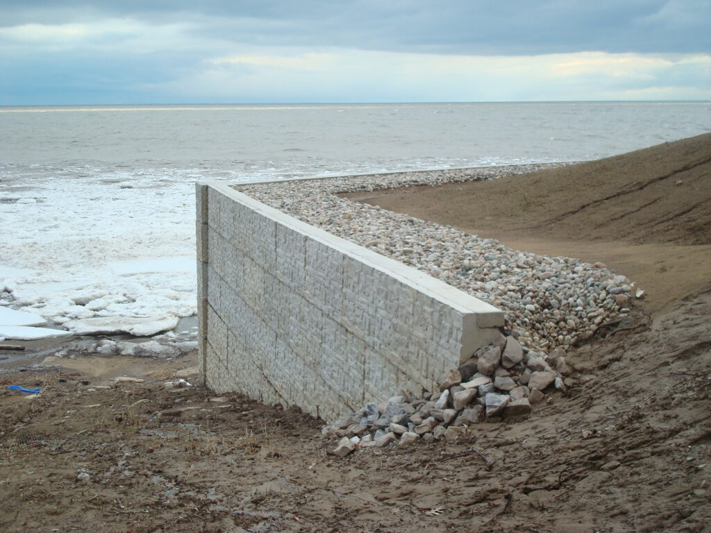 concrete retaining wall beside lake